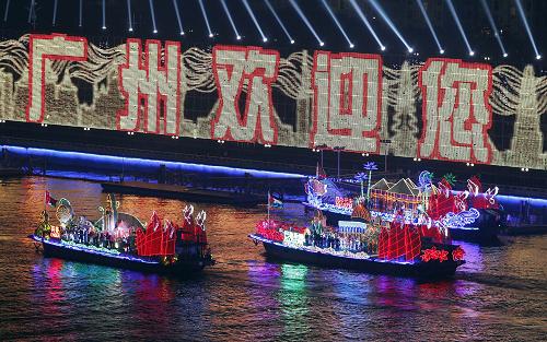 11月12日,第16届亚洲运动会开幕式即将在广州海心沙岛举行。这是彩船在珠江上巡游。新华社记者 任正来 摄